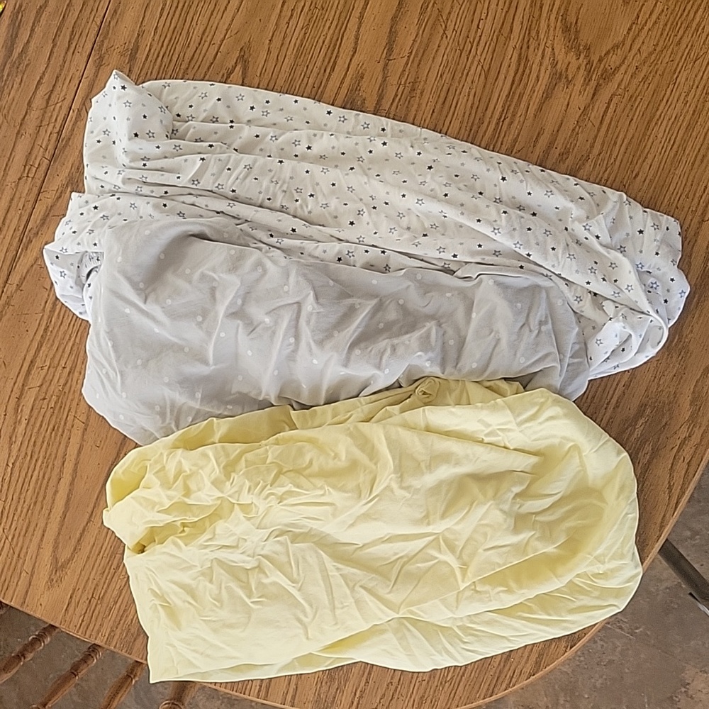 Three fitted crib sheets